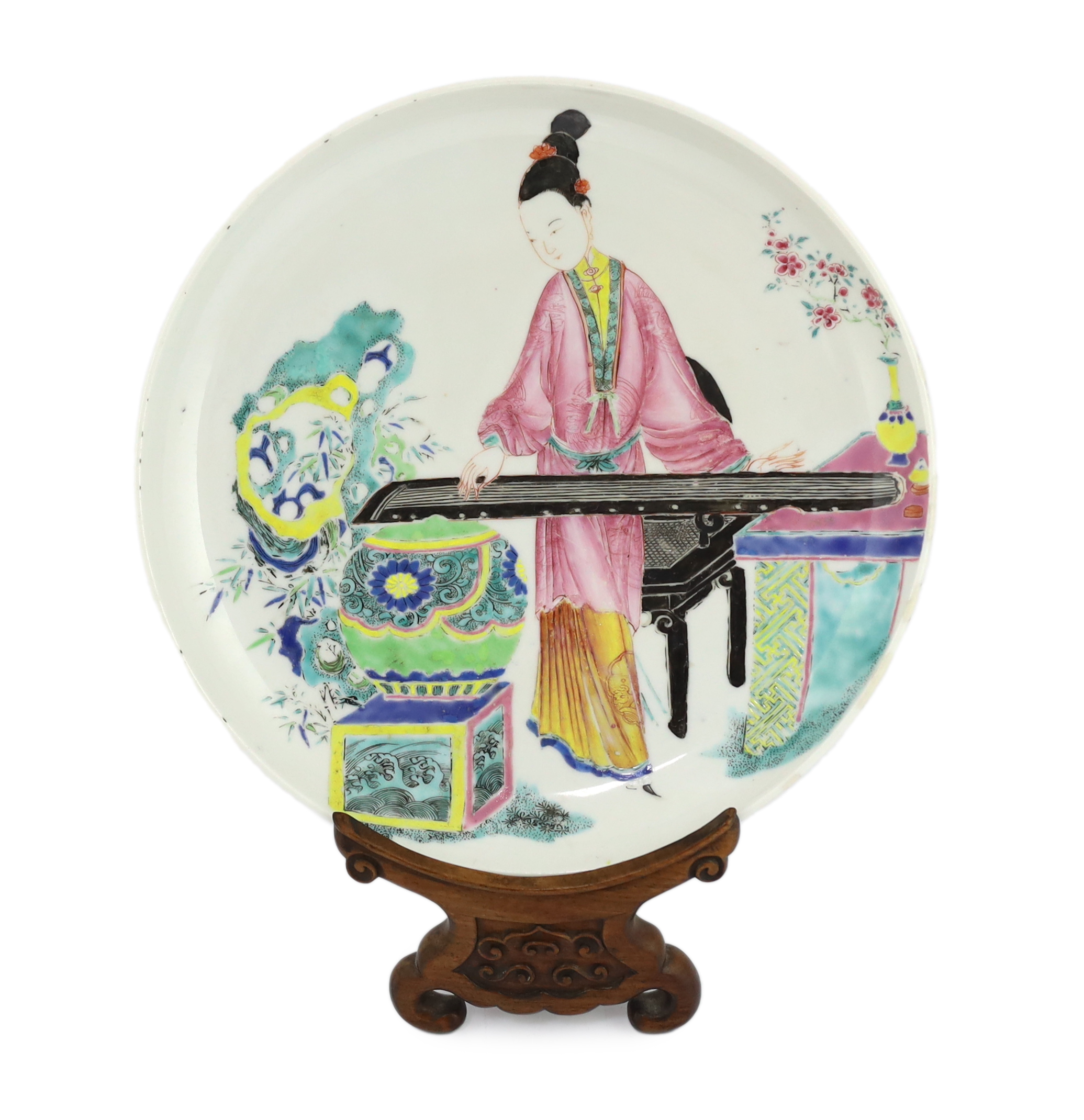 A Chinese famille rose saucer dish, Yongzheng period, repainting to enamel colours, Please note this lot attracts an additional import tax of 5% on the hammer price